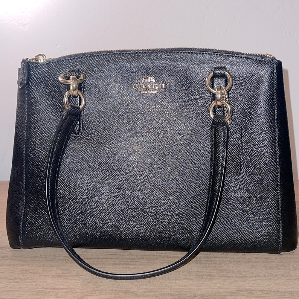Authentic Coach handbag black with gold. Medium/Large size bag.